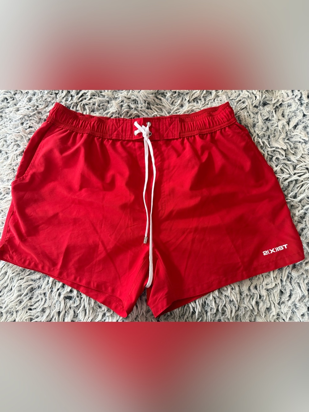 2xist men’s red lined 5” swimsuit. It is a size large.